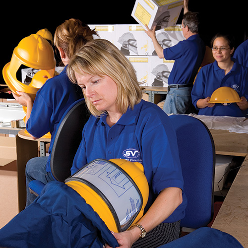 Supreme Visors staff member constructing visors